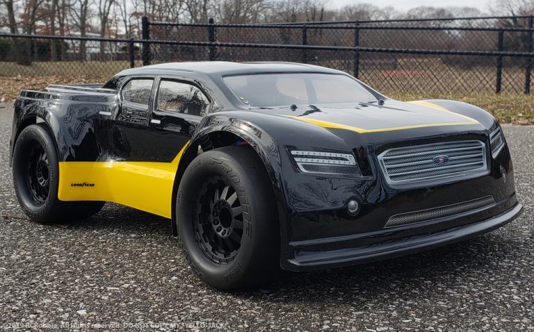 URCG Edition - Traxxas Slash 4x4, JConcepts body - Black Illuzion, ProLine Prime Tires - named Yello' Jack (front view)