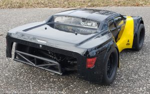 URCG Edition - Traxxas Slash 4x4, JConcepts body - Black Illuzion, ProLine Prime Tires - named Yello' Jack (rear view)