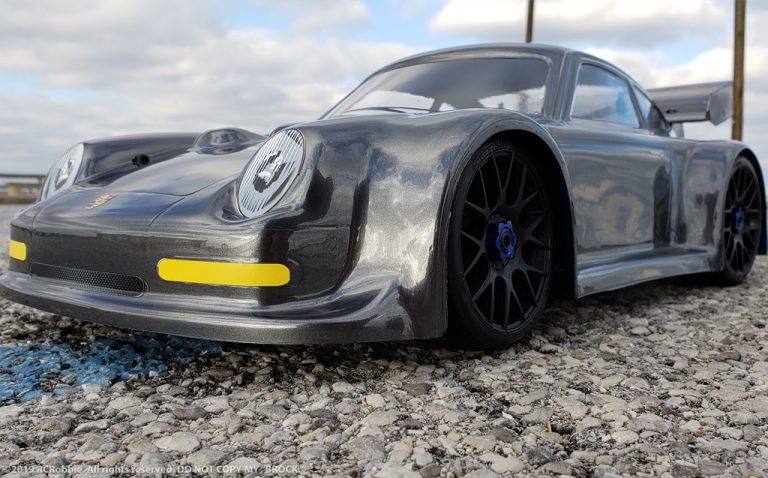 URCG Edition - Traxxas Slash 4x4, Delta Plastik USA body - Gunmetal Porsche 911 GT3, Sweep Racing Tires - named Brock (front view)