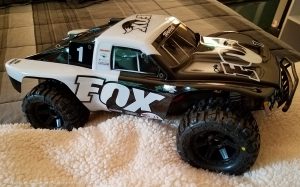 URCG Edition - Traxxas Slash 4x4 TSM OBA - FOX, ProLine Trencher Tires - named Foxy (side view)