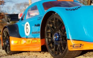 URCG Edition - Traxxas Slash 4x4, Delta Plastik USA body - Blue Porsche 911 GT3, Sweep Racing Tires - named Gulfie (side view)