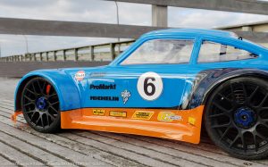 URCG Edition - Traxxas Slash 4x4, Delta Plastik USA body - Blue Porsche 911 GT3, Sweep Racing Tires - named Gulfie (side view)