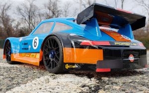 URCG Edition - Traxxas Slash 4x4, Delta Plastik USA body - Blue Porsche 911 GT3, Sweep Racing Tires - named Gulfie (rear view)