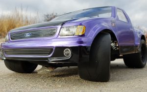 URCG Edition - Traxxas Slash 4x4, JConcepts body - Purple Ford 99 Lightning, ProLine Prime Tires - named Purple Lightning (front view)