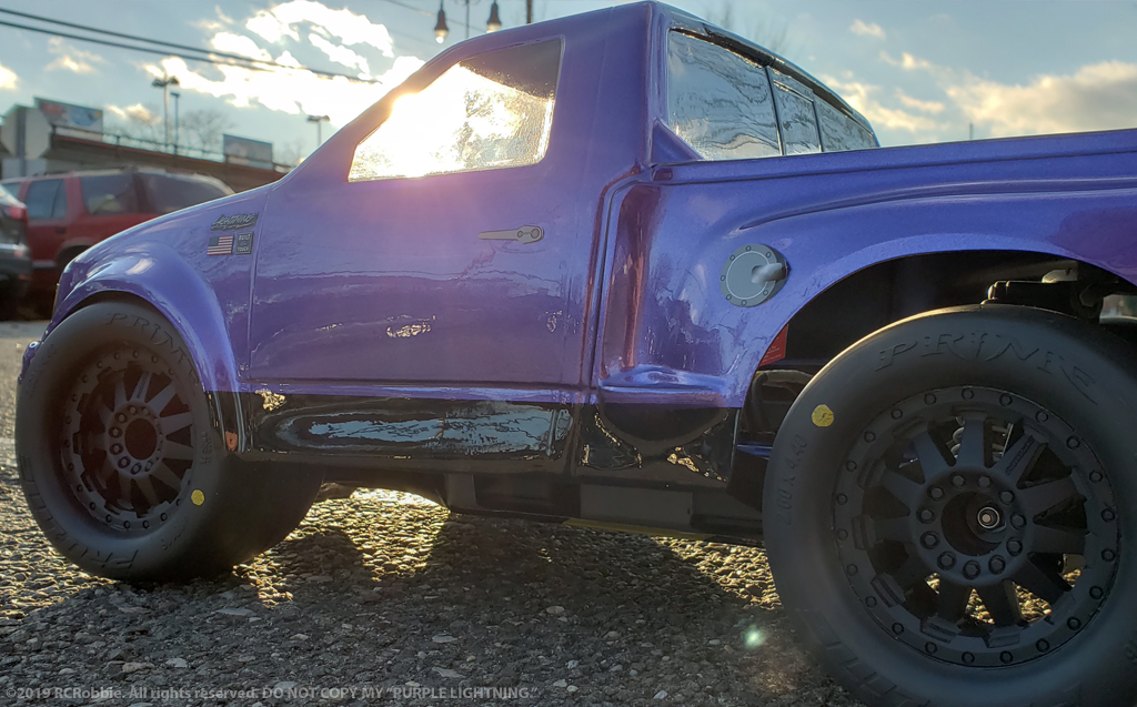 URCG Edition - Traxxas Slash 4x4, JConcepts body - Purple Ford 99 Lightning, ProLine Prime Tires - named Purple Lightning (side view)