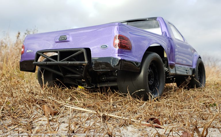 URCG Edition - Traxxas Slash 4x4, JConcepts body - Purple Ford 99 Lightning, ProLine Prime Tires - named Purple Lightning (rear view)