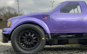 URCG Edition - Traxxas Slash 4x4, JConcepts body - Purple Ford 99 Lightning, ProLine Prime Tires - named Purple Lightning (side view)