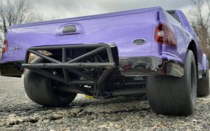URCG Edition - Traxxas Slash 4x4, JConcepts body - Purple Ford 99 Lightning, ProLine Prime Tires - named Purple Lightning (rear view)