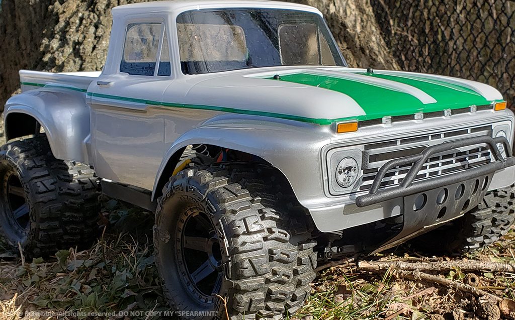 URCG Edition - Traxxas Slash 4x4, ProLine body - White Ford 66 F-100, ProLine Trencher Tires - named Spearmint (front view)