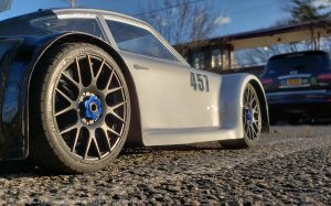URCG Edition - Traxxas Slash 4x4, Delta Plastik USA body - Silver Porsche 911 GT3, Sweep Racing Tires - named Tuxedo Rob (side view)
