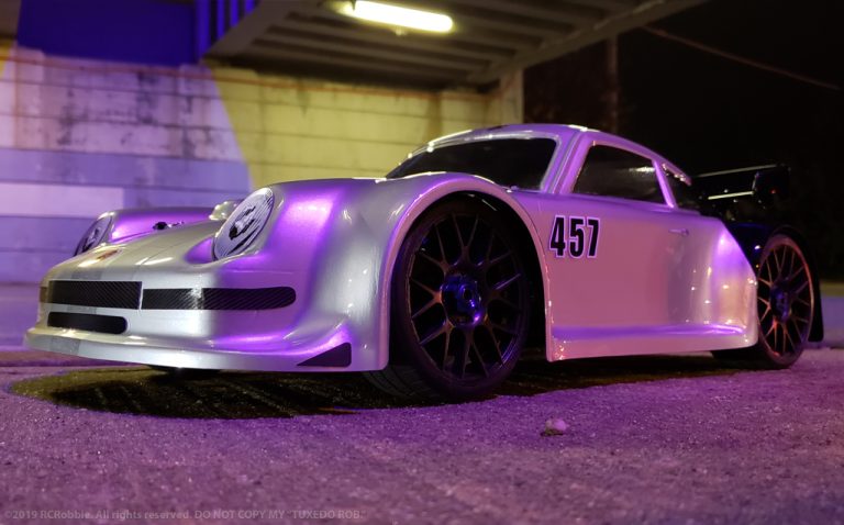 URCG Edition - Traxxas Slash 4x4, Delta Plastik USA body - Silver Porsche 911 GT3, Sweep Racing Tires - named Tuxedo Rob (side view)