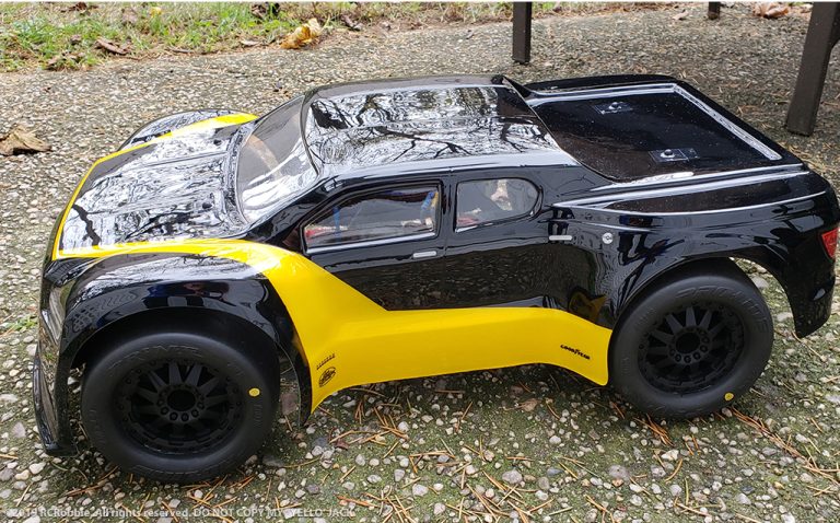 URCG Edition - Traxxas Slash 4x4, JConcepts body - Black Illuzion, ProLine Prime Tires - named Yello' Jack (side view)
