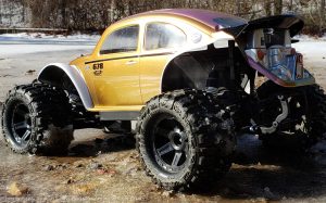 URCG Edition - Traxxas Slash 4x4, Pro-Line body - Iridescent Pink/Gold, Anodized Pink Aluminum Roof, and white fendered Volkswagen Beetle, Proline Trencher Tires - named Buggin' Beetle