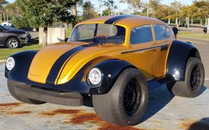 URCG Edition - Traxxas Slash 4x4, Pro-Line body - Gold and black fendered Volkswagen Beetle with racing stripe, Proline Prime Tires - named Gold Buggin'