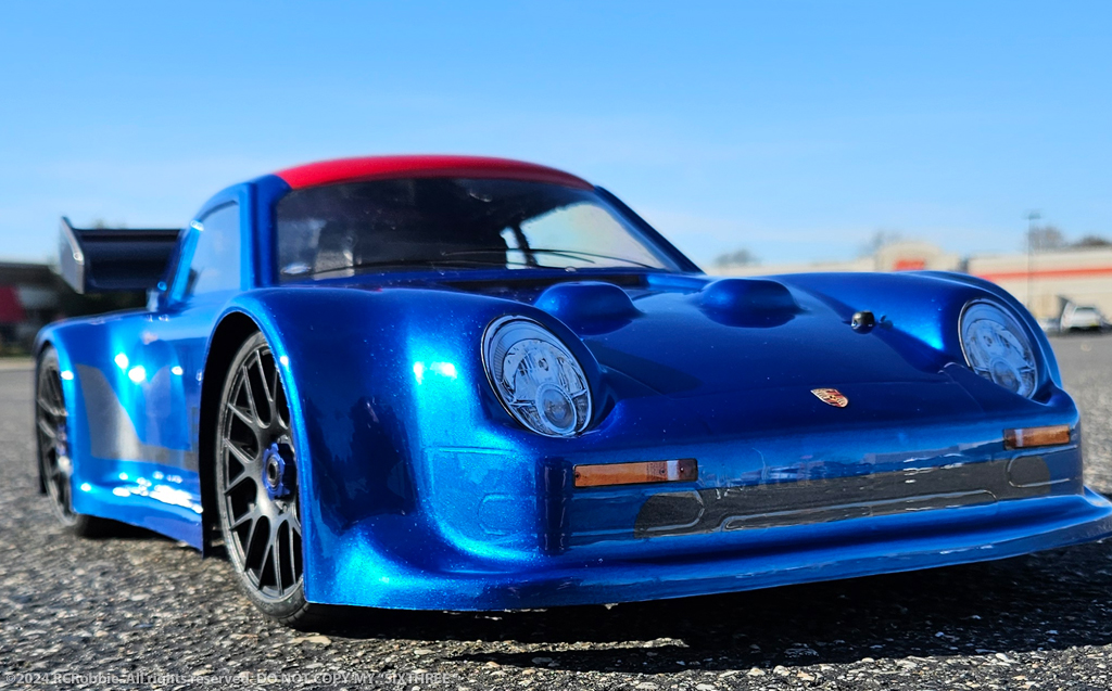 URCG Edition - Traxxas Slash 4x4, Delta Plastik USA body - Metallic Blue Porsche 911 GT3, Sweep Racing Tires - named SixThree