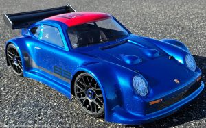 URCG Edition - Traxxas Slash 4x4, Delta Plastik USA body - Metallic Blue Porsche 911 GT3, Sweep Racing Tires - named SixThree