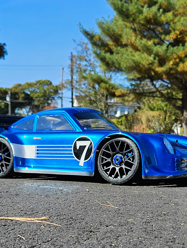 URCG Edition - Traxxas Slash 4x4, Delta Plastik USA body - Metallic Blue Porsche 911 GT3, Sweep Racing Tires - named Breccs