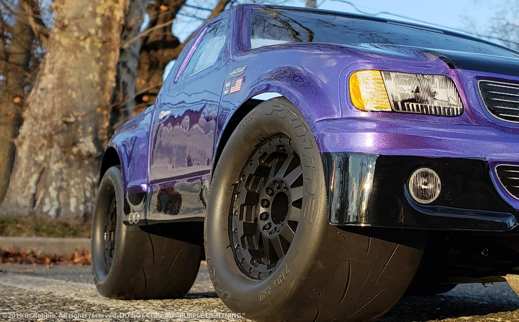 URCG Edition - Traxxas Slash 4x4, JConcepts body - Purple Ford 99 Lightning, ProLine Prime Tires - named Purple Lightning (front view)