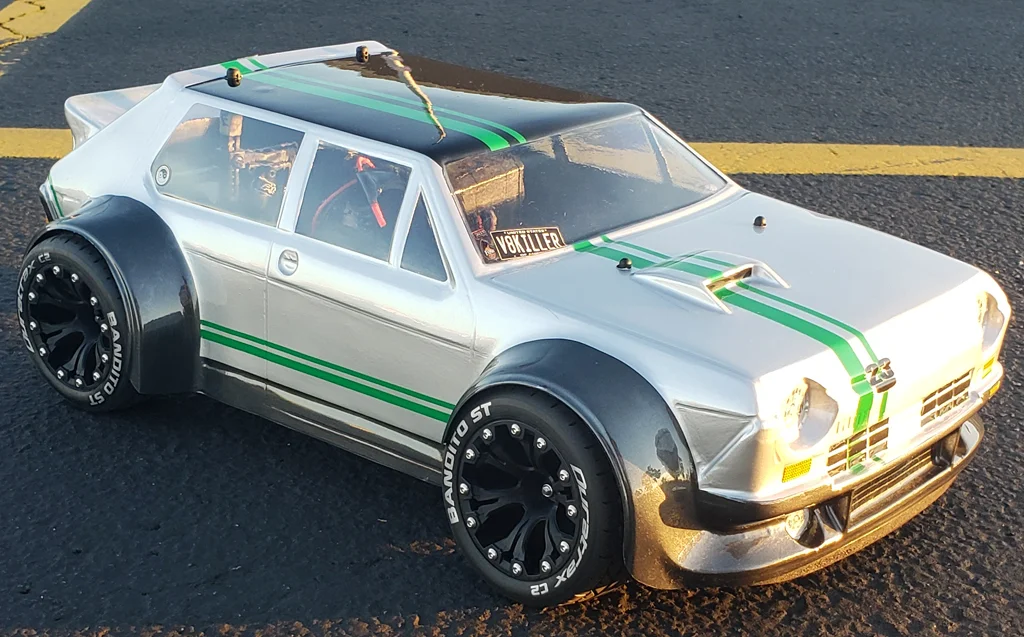 URCG Edition - Traxxas Slash 4x4, Delta Plastik USA body - Silver FR TC 105 Rally GT, Duratrax Bandito Tires - named Fender Juice